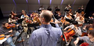 conductor in front of orchestra