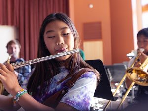 A girl playing flute.