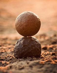 one rock balanced on top of another