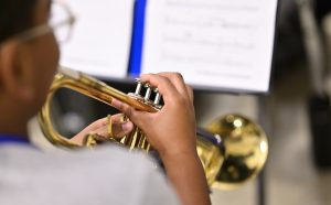 student playing the trumpet