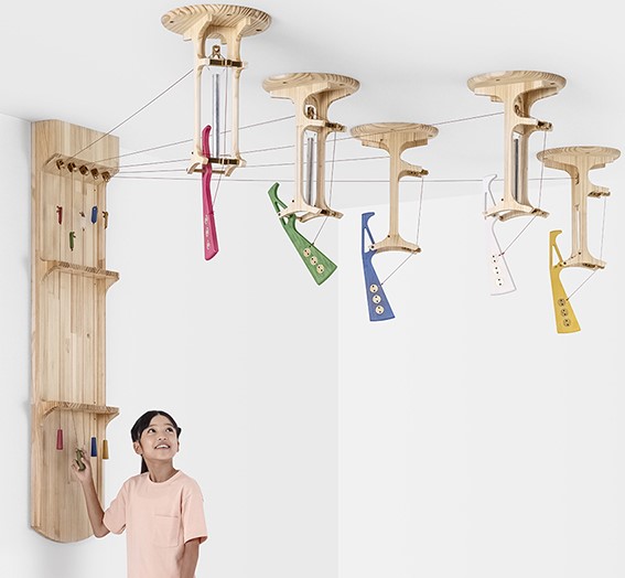 woodpecker_chime_01 Young girl playing with chimes.