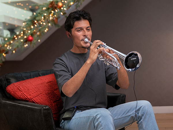 BRDADM792900-Holiday-2023-Blog-Images_xeno_600x450 Young man playing a trumpet with a electronic mute.