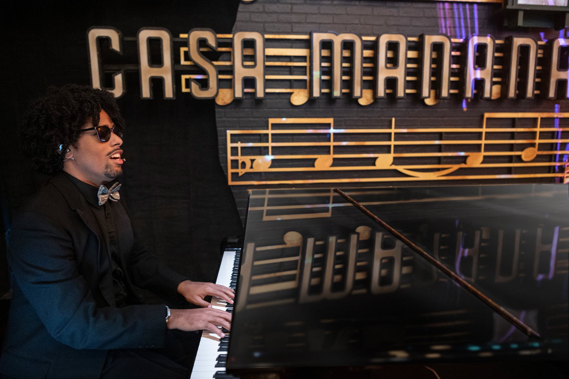 Photo-–-Matt-Whitaker-–-Piano-–-Solo-minresize Man seen in profile playing piano.