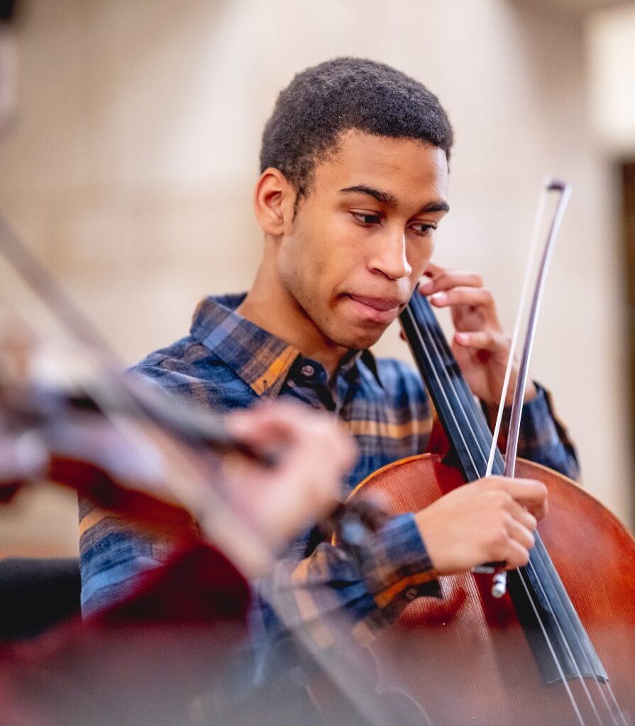 student playing the cello