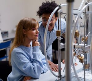 two students working on a science experiment