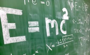 chalkboard with equations on it