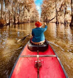 someone rowing in a kayak