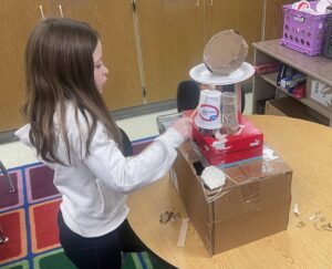 student demonstrating percussion project