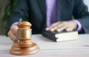 person pounding gavel