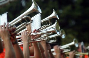 trumpet section during outdoor rehearsal