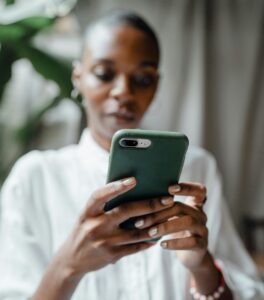 woman holding cell phone