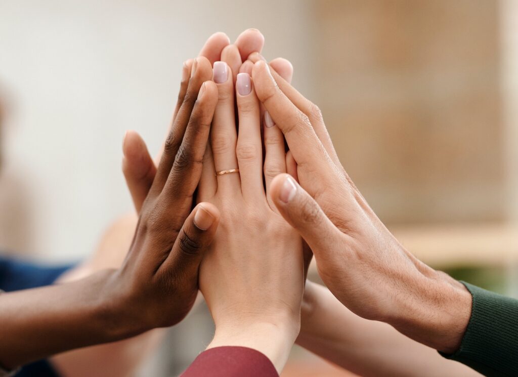 closeup of a group high five