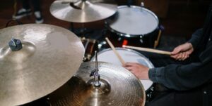 student playing the drum set