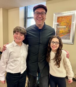 Jeremy Bartunek and two students
