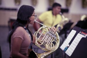 student playing French horn
