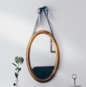 mirror hanging on wall