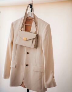 coat and purse on a hanger