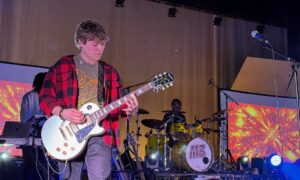 Abington School District student playing the guitar