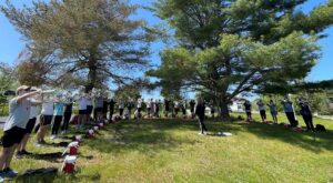 Boston Crusaders practicing under a tree 