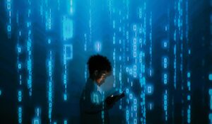 child holding tablet with coding language is shown all around him 