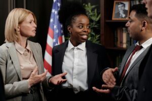 three elected officials speaking