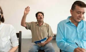 adult student raising hand