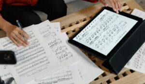 female teacher review score on paper and tablet