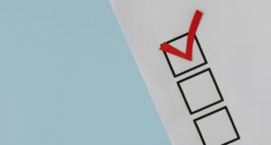 closeup of checklist with a red checkmark in first box