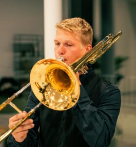 student playing trombone