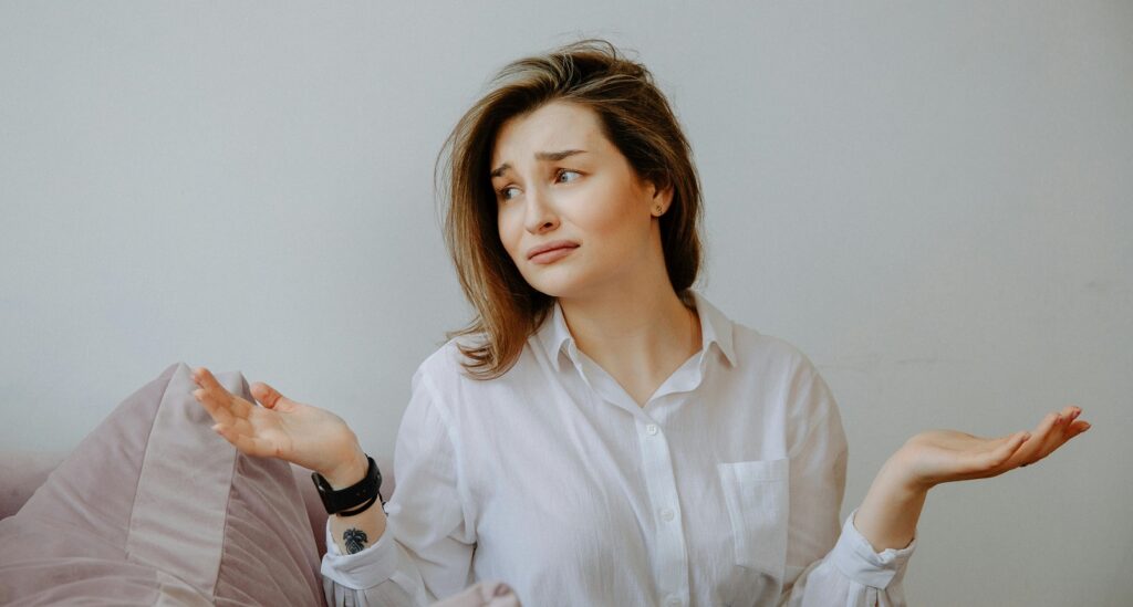 confused woman shrugging
